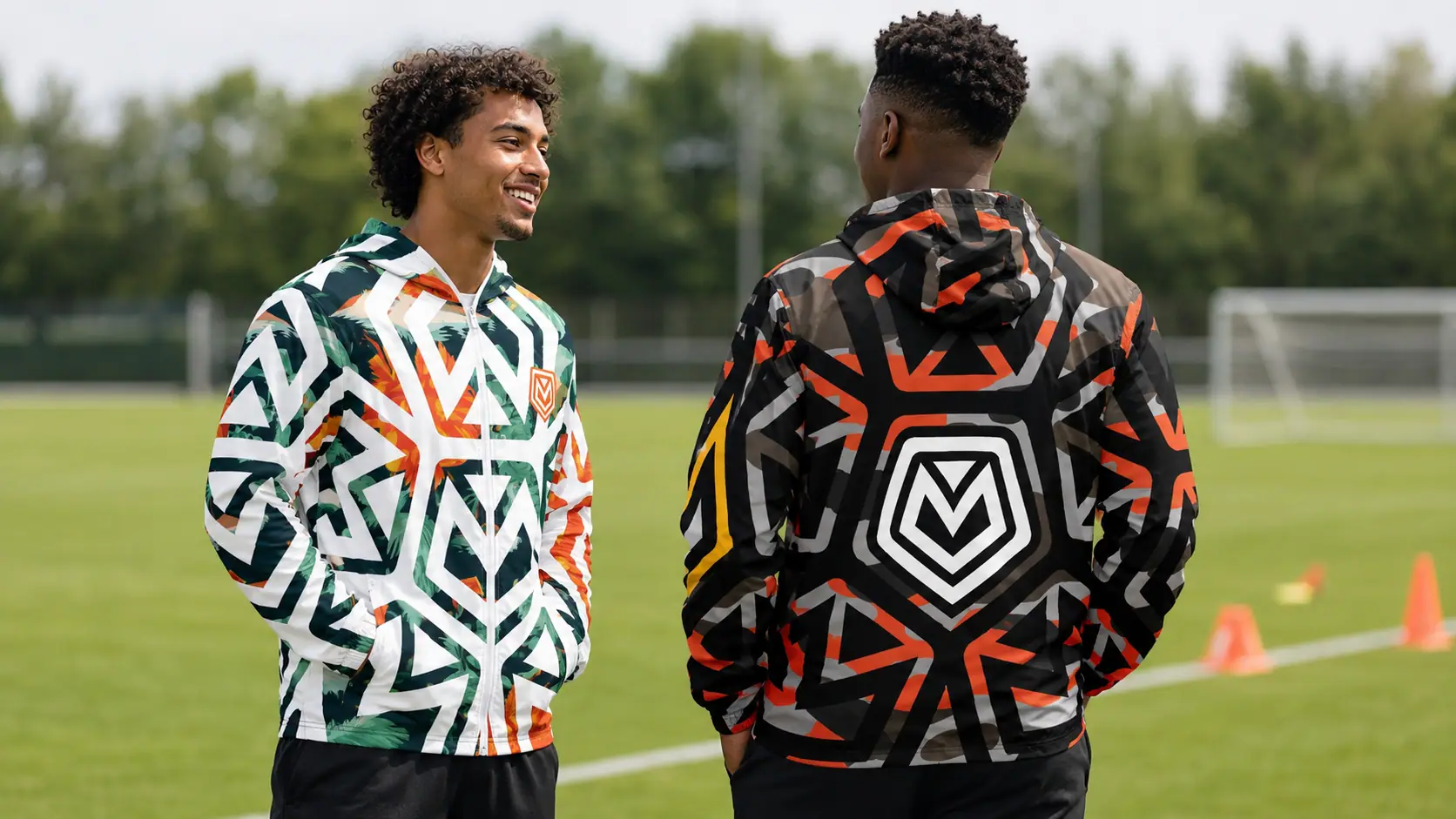 Two men from behind showing the Quint Major emblem on PENTA jackets